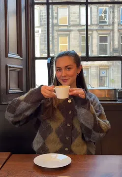 27-year-old enjoying a perfect Sunday in Edinburgh, sipping coffee, shopping, and dining at local restaurants.