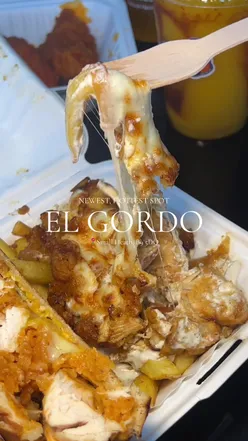 Patrons enjoying the TikTok HADOUKEN Special and chicken strips at El Gordo, Birmingham's hottest new eatery.
