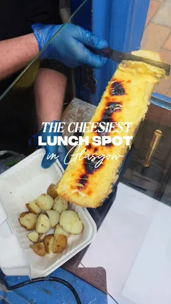 Enjoying a cheesy lunch at Cheese Box in Glasgow's Merchant City, featuring raclette cheese sandwiches and desserts.