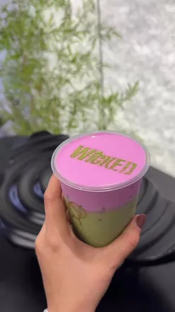 Limited edition WICKED Matcha drink from HEYTEA, featuring pink cloud topping and pomelo flavor, perfect for Halloween.