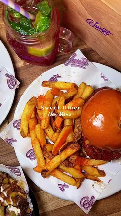 Delicious burgers, waffles, and shakes at @Sweetdiner in Manchester, showcasing their new menu additions.