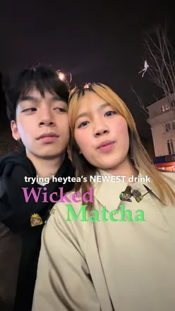 Colorful bubble tea drinks at HeyTea in London, showcasing fun designs and vibrant flavors.