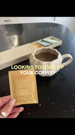 Delicious mushroom coffee from London Nootropics, perfect for your daily routine, surrounded by greenery.