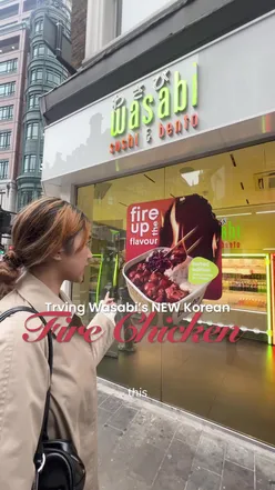 Trying Wasabi's spicy Korean fire chicken bento in London, featuring a bold challenge with friends.