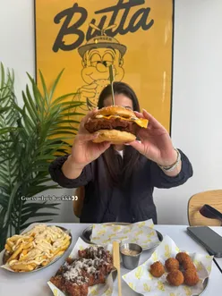 Delicious chicken burgers and Parmesan fries at Butta Burger Edinburgh, featuring a tasty milkshake to complement the meal.