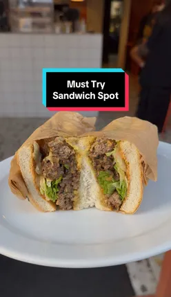 Enjoying a delicious sandwich at Donny's, a former kebab shop in Hackney, London.