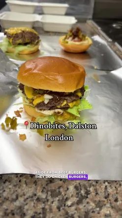 Enjoying a duranno double cheeseburger and Cajun fries at Dino Bites in Dalston, London.