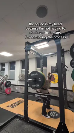 Fitness enthusiasts enjoying a nutritious meal while discussing their health journey at a vibrant café.