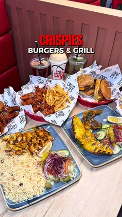 “Deliciously crafted burgers and wings at Crispies UK, showcasing local produce and a fun dining experience.”