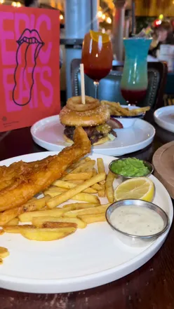 Guests enjoying drinks and appetizers at Revolution Bars in Liverpool with January discount offer.