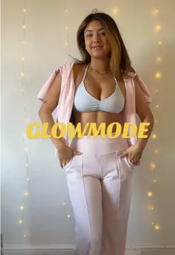 Two girls excitedly showcasing a chic houndstooth winter sweater, emphasizing its luxurious feel and stylish fit.