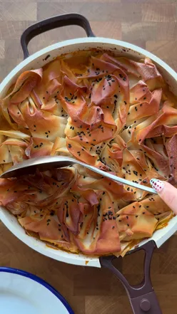 Coconut chicken curry pie served with mint yogurt and mango chutney, a delicious dish for four.