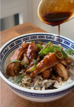 Soy sauce chicken dish with ginger and garlic, inspired by Hong Kong cuisine, served over rice for a delightful meal.