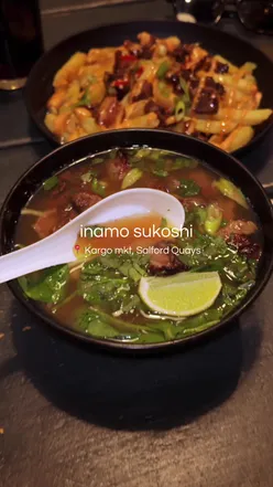 Family enjoying Korean BBQ ribs, duck ramen, and dragon rolls at Inamo Sukoshi, Kargo MKT, Salford Quays.