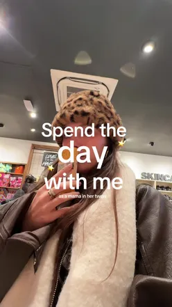 Mom and toddler enjoying a cozy day with books and wellness products, capturing sweet moments in a vlogger's life.