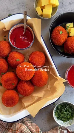 Homemade peri peri chicken cheese balls prepared for Ramadan, featuring spices and melted cheese, ready for frying.
