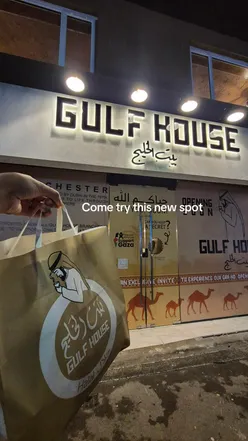 Excited diners enjoying delicious halal food at a trendy new restaurant in Manchester.