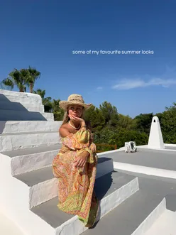 Person enjoying summer vibes in a vibrant outfit, surrounded by flowers and sunlight. #summerfashion #holiday