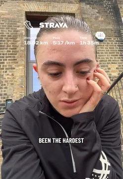 Runner training for an ultra marathon during a challenging workout session in scenic outdoor setting.