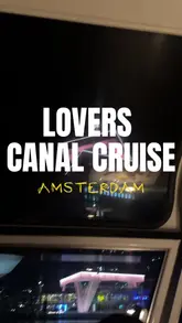 A short vlog-style video showcasing a 4-course dinner canal cruise in Amsterdam. The video features shots of the boat's interior, the passing city lights at night, and the food served on board.