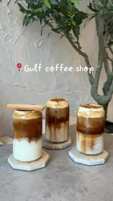 People enjoying iced coffee at Gulf Coffee Shop, a favorite spot in Manchester, with a cozy atmosphere.