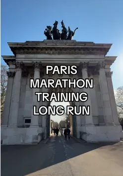 Runner on a 17-mile training run through sunny London for the Paris Marathon with vibrant city scenery.