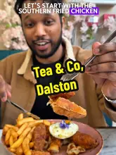 A creator visits 'Tea & Co' to review their brunch menu, highlighting the Matilda cake, southern fried chicken and waffles, and karak chai.