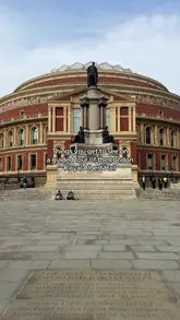 A guided tour of the Royal Albert Hall, highlighting historical features, the organ, private boxes, and the use of interactive handheld devices to view archival footage.