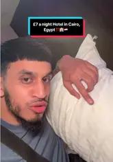 The creator provides a comprehensive tour of a budget hotel in Cairo, Egypt, highlighting the lobby, elevator, room amenities, bathroom, and the view of the pyramids. He also includes a brief look at the complimentary breakfast, emphasizing the low cost of the stay.