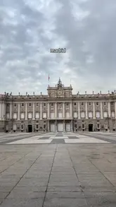 A travel montage showcasing various landmarks in Madrid, followed by a brief sequence inside the Mercado de San Miguel featuring various tapas and street food items.