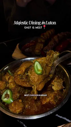 Delicious mixed grill platter at East is West in Luton, featuring vibrant dishes and halal options.