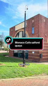 A vlog-style video showcasing a visit to Monaco Cafe in Salford Quays, highlighting the waterfront location, the interior decor, and the brunch menu.