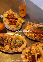 Vibrant interior of Madre Mexican restaurant in Leeds with a frozen spicy mango marg, pork tacos, nachos & a pool table.