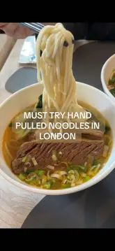 A short, engaging review of Baker Noodles in London, focusing on their hand-pulled noodle dishes. The video features close-up shots of the food, including beef short rib and braised beef brisket, demonstrating the texture and preparation.