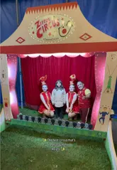 A montage video showcasing a visit to Zippos Circus, featuring various acrobatic performances, clown acts, and the venue entrance.