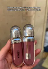 A short video showcasing the process of getting a custom engraving on a Kiko Milano lip gloss at their Rome store. The video highlights the location and the affordable price of the service.