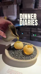 A short video showcasing a meal at Kricket, featuring various Indian-inspired dishes like pani puri, bhel puri, Keralan fried chicken, and coconut chicken curry, along with a birthday dessert.