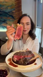 A review of Myrtos, a Greek restaurant in South Kensington, London. The creator showcases a variety of dishes including taramasalata, snail pita, bluefin tuna, lamb moussaka, grilled octopus, beef sirloin, beetroot, greek wild greens, milk chocolate mousse, and portokalopita, along with cocktails. The video highlights the restaurant's interior design inspired by Myrtos Beach in Kefalonia.