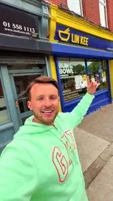 The creator visits a combined Bun & Bowl and Lin Kee venue, showcasing the exterior and then reviewing a 'munchie box' and a burger meal deal in his car. He highlights the affordability and variety of the food, including burgers, tenders, wings, and Chinese-style sides like curry sauce and spring rolls.