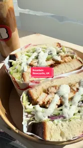 A promotional video for Breadwin in Newcastle, highlighting their sandwich selection and unique canned drink options.