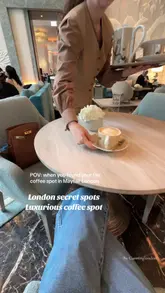A short, aesthetic video showcasing the interior of the Four Seasons hotel in Mayfair, focusing on the lobby lounge, floral arrangements, and coffee service. The video uses slow, smooth pans and cuts to create a luxurious, calm atmosphere.