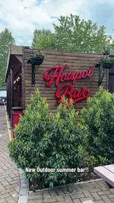 A video tour of an outdoor bar area at South Causey Inn, showcasing the seating, decor, and bar structure.