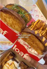 A short, fast-paced review of 'Loaf', a sandwich shop in London. The video features the creator trying various menu items including hot honey chicken and steak sandwiches, milkshakes, and French toast, highlighting the generous portions and quality of the food.