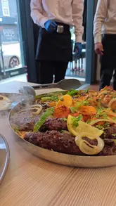 A review of Sabir's Grill in Sheffield, highlighting their mixed grill, fusion pizza, BBQ beef ribs, and dessert options.