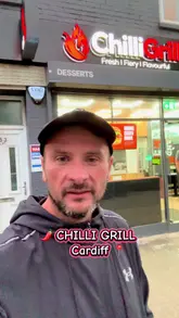 A review of Chilli Grill in Cardiff, featuring a look at their pizza, chicken protein box, burger, and cheesy garlic bread. The video highlights the homemade dough and sauce, the generous portion sizes, and the overall quality of the takeaway food.