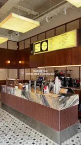 A short, aesthetic montage showcasing a London venue that operates as a coffee shop during the day and a cocktail bar at night. The video features close-ups of coffee preparation, cocktails, pastries, and the interior design, effectively communicating the venue's atmosphere.