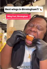A fast-paced, engaging review of the Wing Fest pop-up event located inside Selfridges, Birmingham. The creator samples various chicken wings, tenders, and sides, providing a clear overview of the food options available.