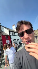 A short, informative vlog showcasing the Smallest House in Great Britain located in Conwy, Wales. The creator provides historical context about the house, including its size and past inhabitants, while giving viewers a tour of the exterior and a glimpse inside.